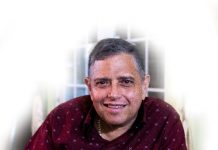 Albert Osric Croes A person in a red shirt Description automatically generated with low confidence