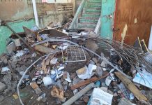 BCI a recoge dump ilegal den centro di Oranjestad