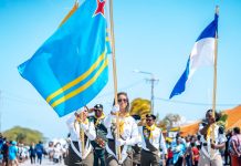 Gruponan uniforma cu meta comunitario ta wordo invita pa participa den desfile nacional Dia di Himno y Bandera