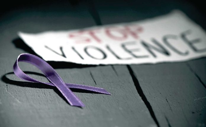 purple ribbon against the violence against women