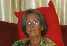 Angela “Lucia” Stamper A person sitting on a couch AI-generated content may be incorrect.