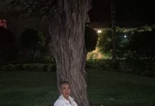 Xiovanne Eleuteria Caciano A person sitting under a tree AI-generated content may be incorrect.