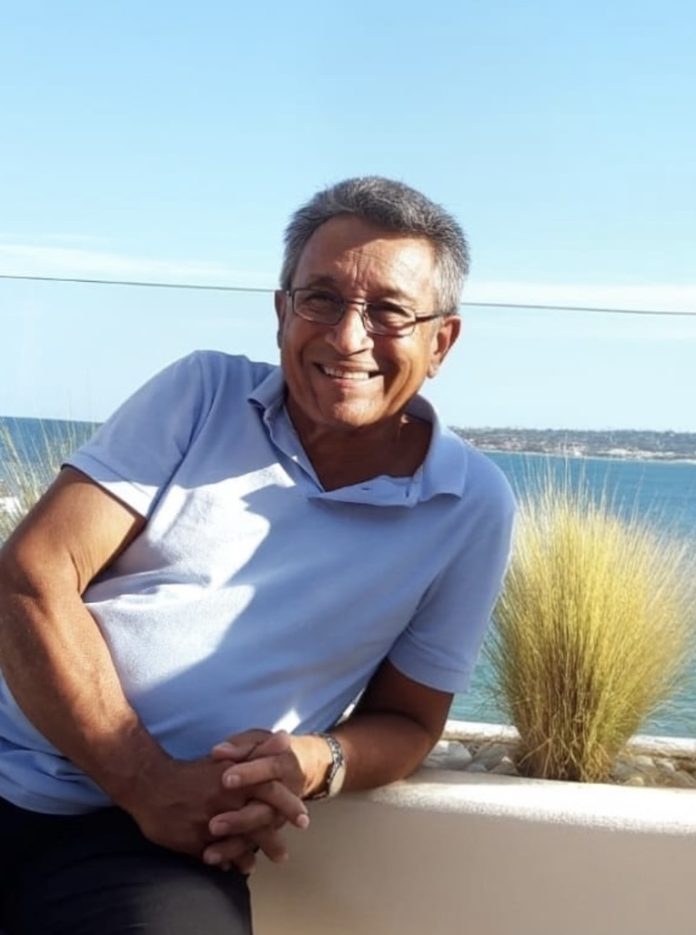 Screenshot A person sitting on a bench Description automatically generated