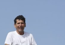 Francisco Angelos Lopez A person sitting on a rock AI-generated content may be incorrect.