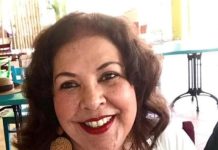 Vivian E. Storm-Croes A person smiling at the camera AI-generated content may be incorrect.