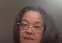 Olivia Valentina Croes A person wearing glasses and a grey shirt AI-generated content may be incorrect.