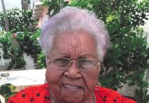 Sra. Irma B. Commenencia-Lesire An old person wearing a red shirt AI-generated content may be incorrect.