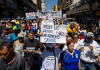 Inflacion, devaluacion y frenamento petrolero ta crea un “mescla explosivo” den economia di Venezuela